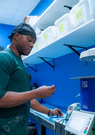 Dr. Emeka Abazie crafting dental veneers