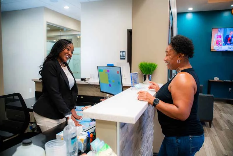 patient paying for services at 10 Day Smiles